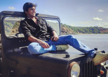 Shalva Kinjawadekar sitting on a jeep