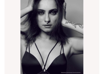 black and white picture holding her head