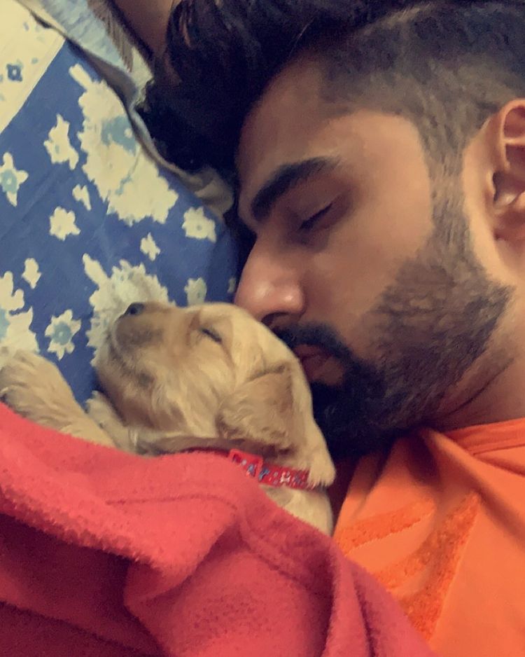 Mridul lying with his puppy