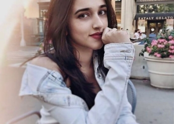 Darekar wearing a denim jacket