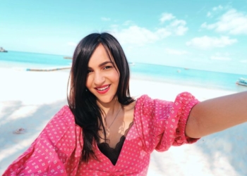 Malhan in a red dress