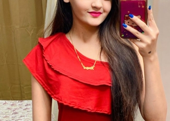 Kavya taking mirror selfie in red dress