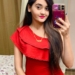 Kavya taking mirror selfie in red dress
