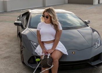 Haleigh sitting on a car