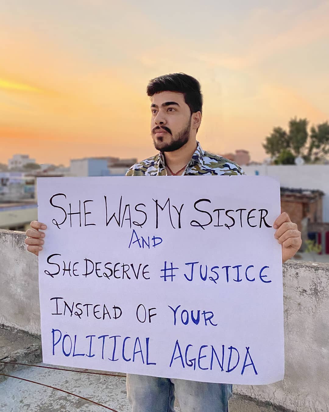 Samraat bhai with a poster promoting Justice. 