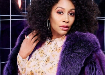 Simone wearing purple overcoat