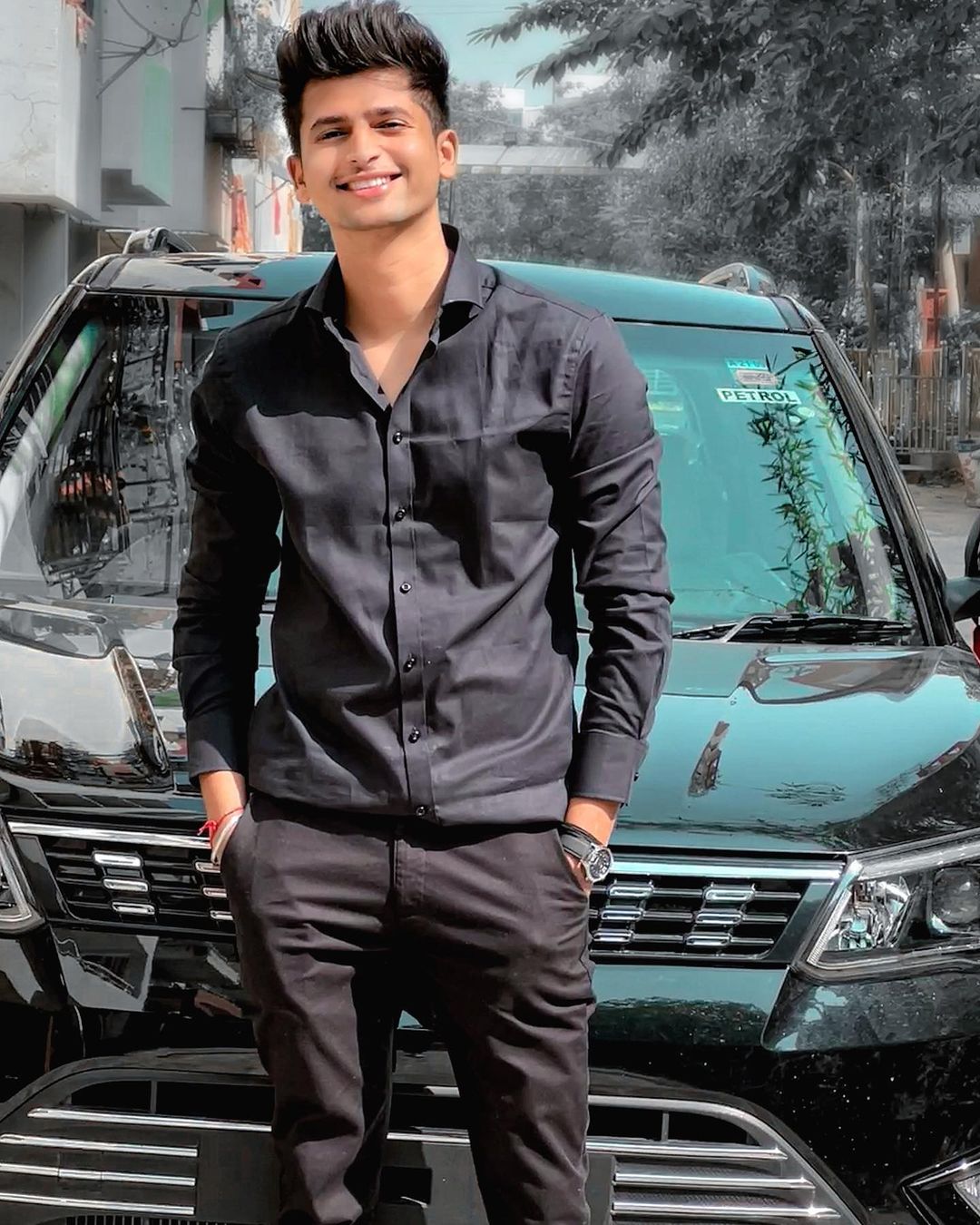 Rajat with his new car. 