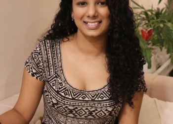 Gautami sitting on sofa