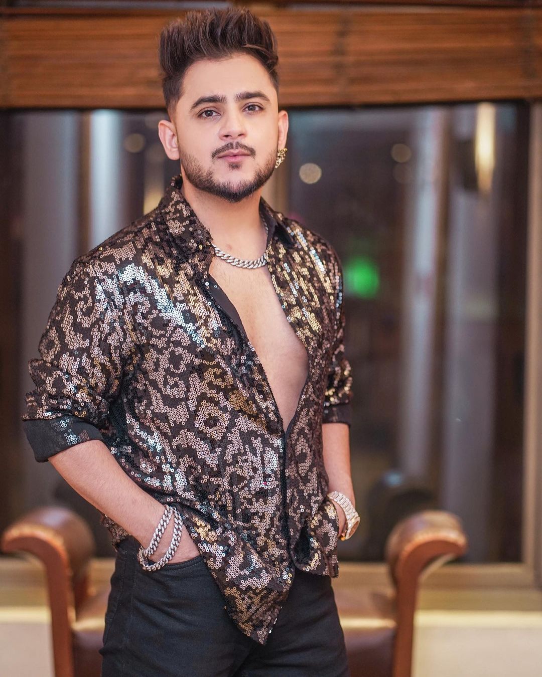 Millind Gaba in black print shirt