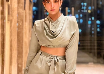 Ashnoor wearing silver outfit