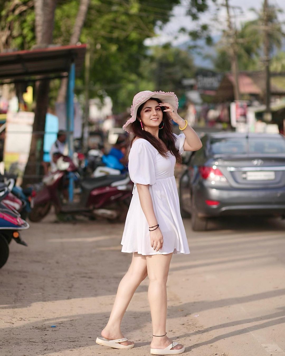 Neha Bagga in white dress and white hat