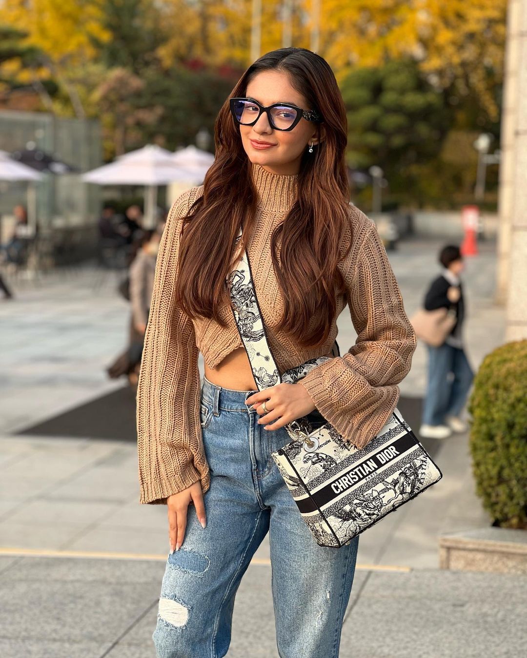 Actress Anushka Sen in brown sweater and blue jeans