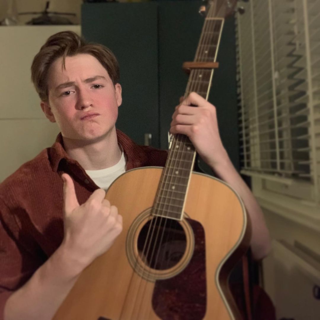 Kit with his guitar. 