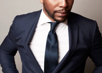 Jocko posing in a black suit.