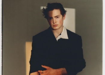 Kit Connor posing in black.