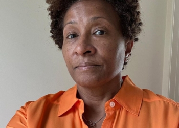 Lucas Claude Syke's mother in orange shirt