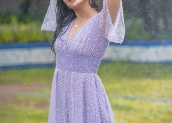 Malvika Sharma enjoying rain with a lavender dress