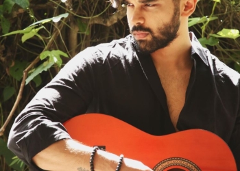 Dhruv Vikram playing guitar