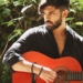 Dhruv Vikram playing guitar