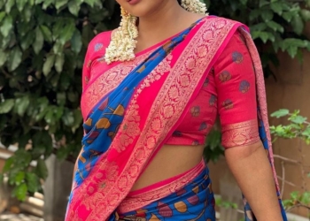 Reshma Pasupuleti in blue saree and flowers in her hair