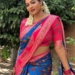 Reshma Pasupuleti in blue saree and flowers in her hair