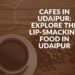 A cup of coffee with a text on the image "Cafes In Udaipur."