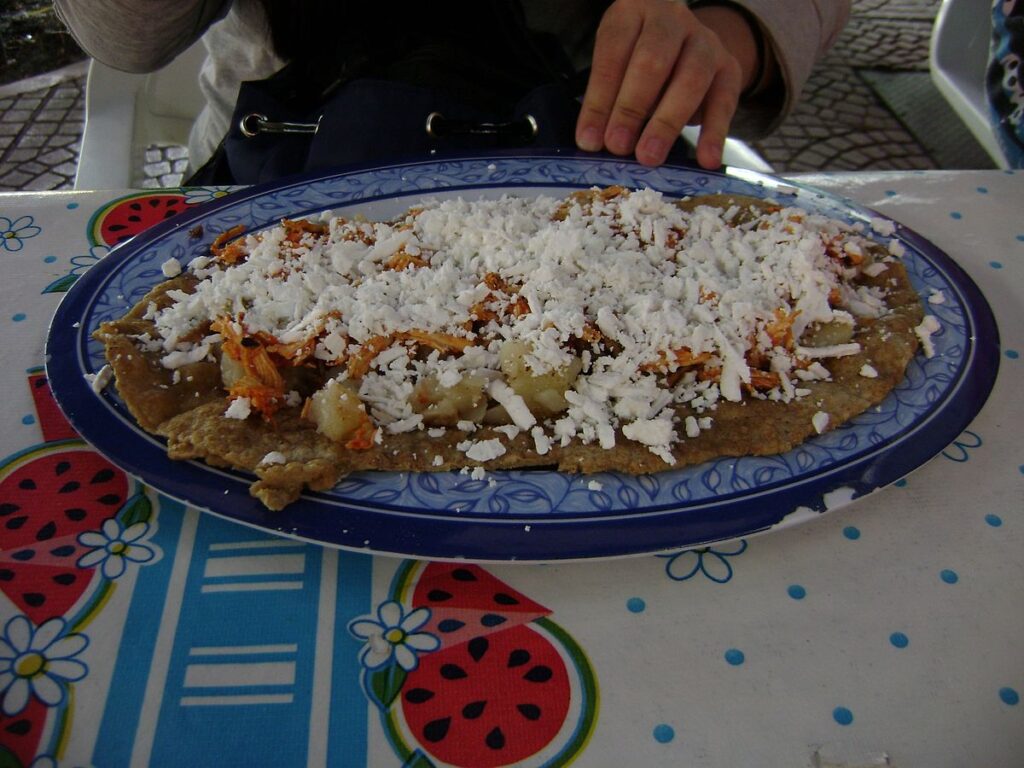 Huaraches served traditionally in a blue colored plate