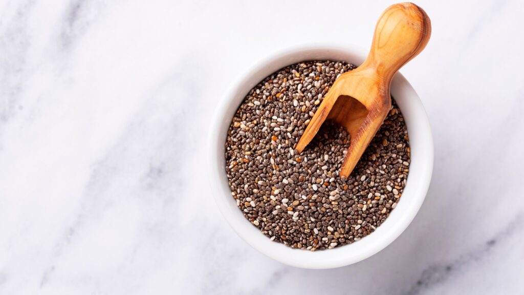 A white bowl full of Chia seeds 