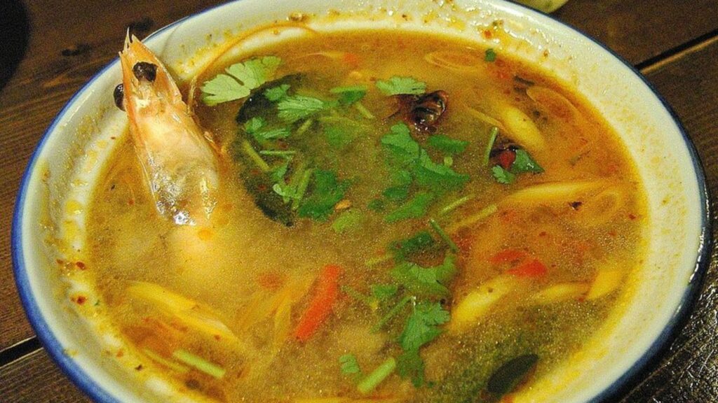 Thai Tom Yam soup served ina white colored bowl.