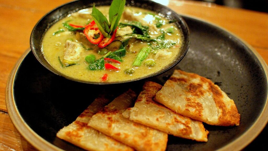 Green curry served with roti