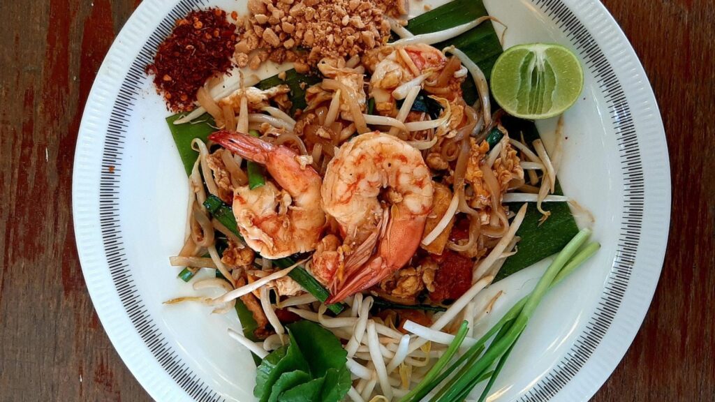 Pad Thai served in a white plate.
