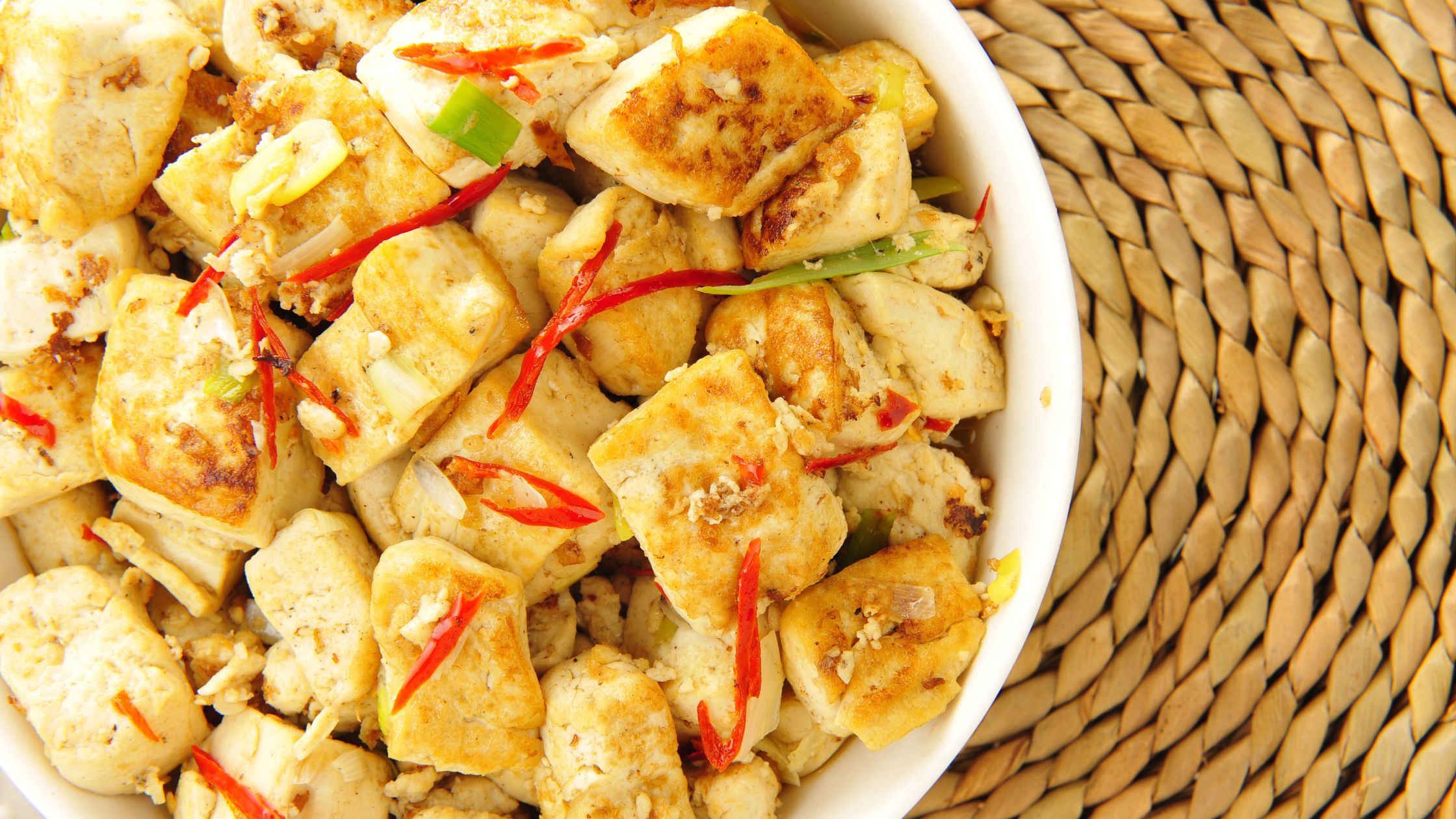 A bowl of cooked tofu. 