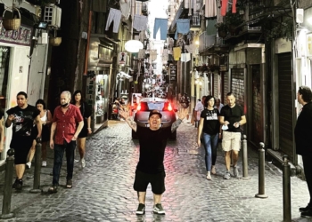 Wee Man standing on the streets of Italy.