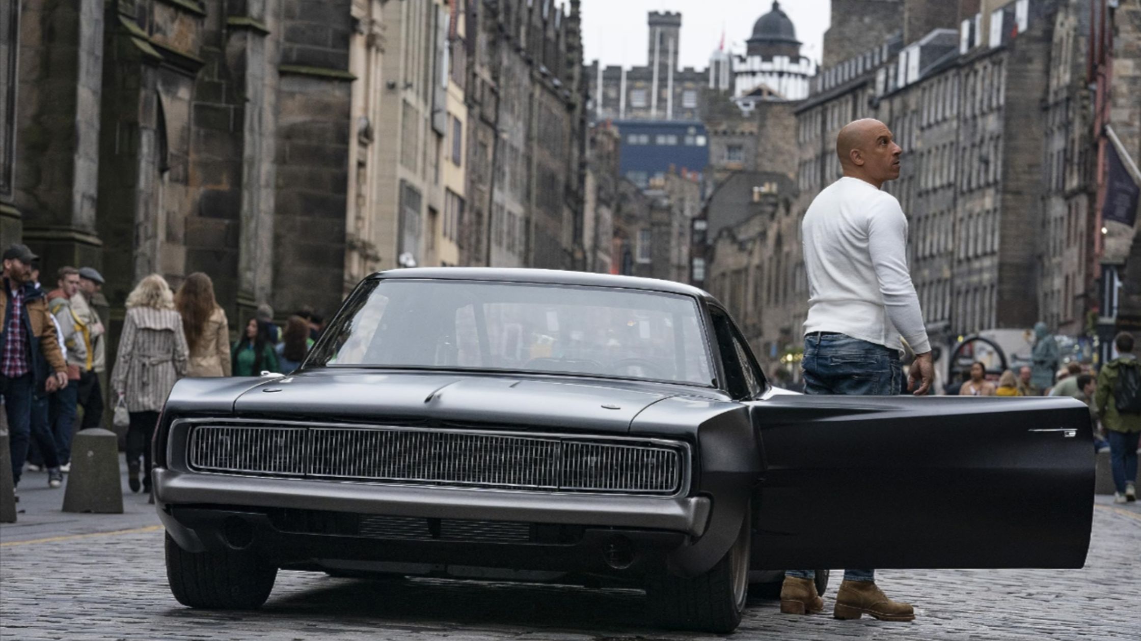 A scene from Fast and Furious Franchise. Vin Diesel walking out of his car.