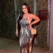 Candy Aguilar wearing a black colored outfit designed by Sebastianaiden.