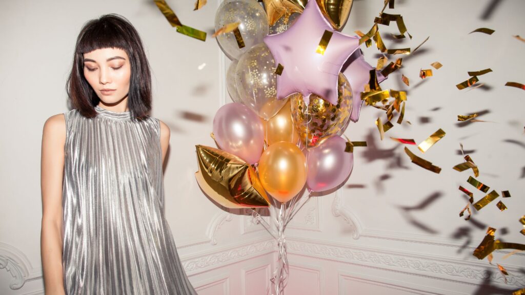 A girl wearing silver colored dress on her birthday