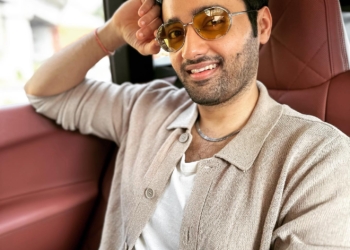 Utkarsh Sharma taking selfie. He is wearing sunglasses while taking selfie.