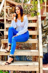 Fiza Choudhary sitting on the stairs